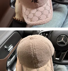 Detail view of the fuzzy plush baseball cap featuring rhinestone patterns and winter warmth.