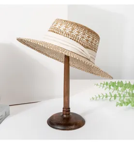 Detailed view of women summer straw sun hat, British style color block woven fedora hat.