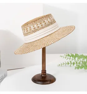 Women woven straw hat detail, chic summer sun protection boater hat elegant brim.
