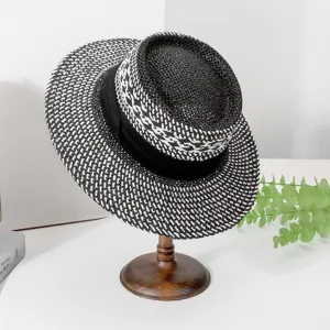 Classic black and white woven fedora straw hat with chic ribbon, perfect for summer sun.