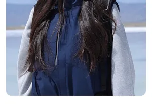 Detail shot of outdoor waterproof jacket with long sleeves, cozy wear for cold weather and hiking.