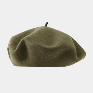 Olive green wool beret detail shot, classic vintage felt painter hat for autumn and winter.