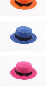Straw hat detail showcasing vibrant colors and cute bowknot for summer beach wear style.