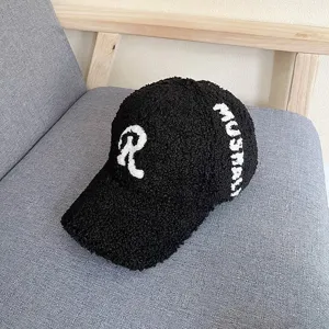 Black lambswool baseball cap for women, cozy winter plush hat with white embroidery letter.