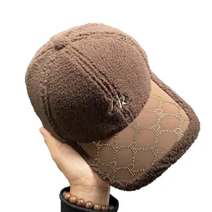 Brown lamb wool baseball cap with rhinestone brim monogram design and front embroidery.