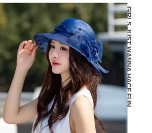 Blue mesh sun hat with cute polka dots and flower decor, perfect for summer outdoor style.