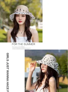 Details of the breathable straw sun hat featuring black polka dots and elegant veil decoration.