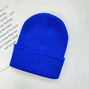 Royal blue winter knit beanie hat, cozy solid color cuffed pullover cap for adults daily wear.