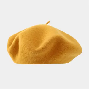 Detail shot of solid color wool beret, classic retro artist hat style for autumn and winter.