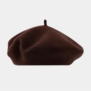 Detailed view of the brown wool beret, showing fine texture and classic vintage painter hat design.