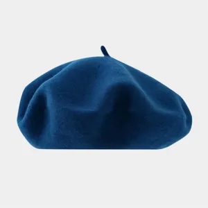Classic dark blue wool beret for women, minimalist solid color vintage painter hat detail.