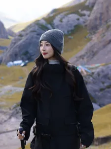 Winter outdoor knit beanie for women, stylish grey wool cap with embroidered mountain logo design.