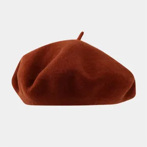 Detailed view of the solid color wool beret, featuring a soft texture and classic design.