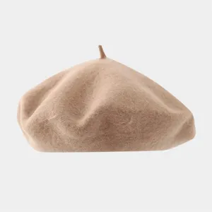Close-up detail shot of a solid color wool beret, soft texture and classic minimalist style.