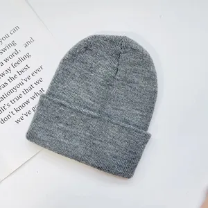 Classic solid color knitted beanie for adults, warm winter pullover hat in grey color.