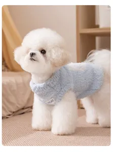 Cozy blue fleece pet vest detail, soft winter sleeveless dog sweater close-up view.