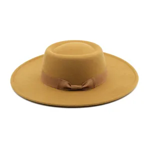 Classic wide brim wool felt boater hat with elegant bow ribbon detail for autumn and winter fashion.
