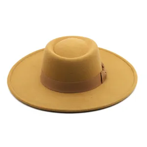 Details of the classic wide brim felt fedora hat with elegant side bow, flat top crown design.