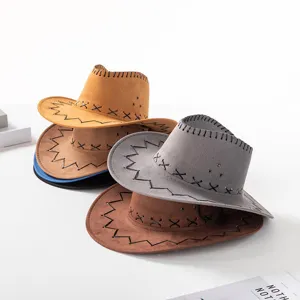 Detail of retro suede cowboy hats stacked, showing cross-stitching and wide brims.