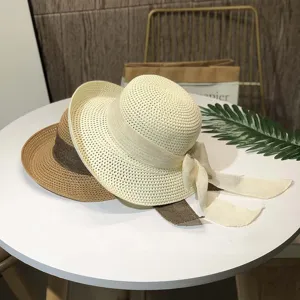 Women summer straw sun hat with elegant bow, wide brim beach vacation sunshade cap stylish.