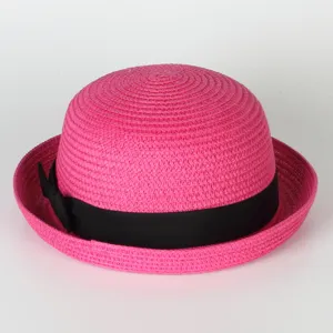 Pink straw bowler hat featuring a classic black ribbon bow, ideal for summer sun protection.