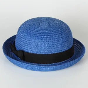 Blue straw bowler hat with black bow detail, perfect close-up view of summer sun protection.