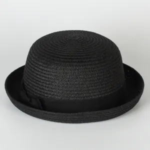 Black straw bowler hat detail close-up, woven texture, classic ribbon bow decor, sun protection.