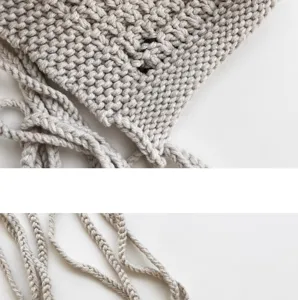Handmade knit tassel beanie hat detail close up cozy winter warm ear protection woolen cap
