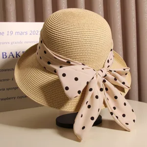 Women summer straw hat with polka dot bow ribbon, chic rolled brim sun protection beach cap.