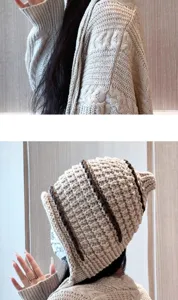 Detailed view of handmade knitted beanie hat and cozy cardigan, autumn winter thermal wear.