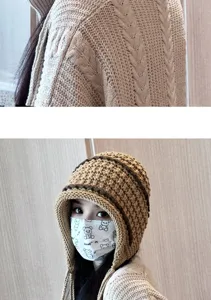 Beige knitted beanie hat with earflaps, thick warm winter tassel cap for women daily wear.