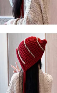 Handmade tassel knit beanie for women, autumn and winter ear-flap hat, detailed view.