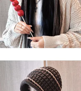 Detail view of handmade crochet beanie hat and knit cardigan, cozy autumn winter style for women.
