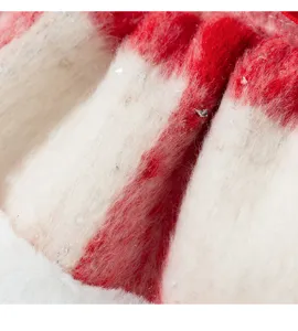 Close-up detail of fluffy red and white pet dress fabric with cute shimmer for winter warm wear.