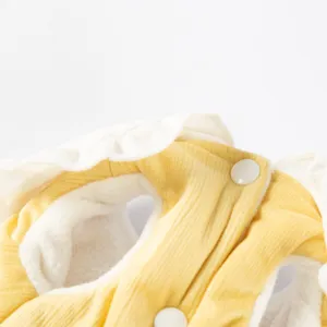 Detailed view of cute pet winter corduroy warm clothes with soft fleece lining and buttons.