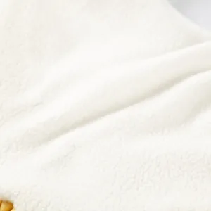 White fleece fabric detail of cute pet winter clothes for small dogs cats puppy comfort warm.