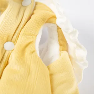 Close-up detail of pet winter warm clothes, showing soft fleece lining and cute white collar.