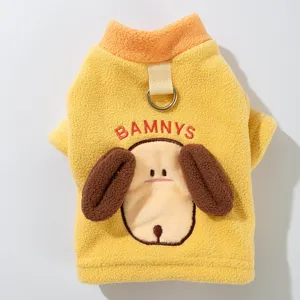 Detailed view of yellow pet fleece dog sweater with cute puppy face and D-ring harness.