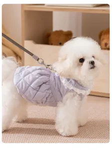 Cozy quilted pet dress for cats and small dogs, featuring warm fabric and a cute white lace collar.