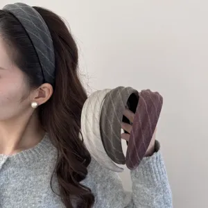 Detail shot showing the soft fabric texture and multi-color options of the chic herringbone headband.
