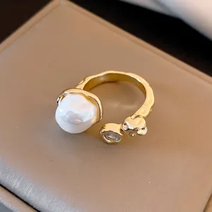 Gold plated irregular pearl ring detail view, elegant light luxury open finger jewelry.