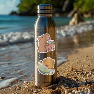 Close-up detail shot of cute capybara waterproof stickers displayed on a stainless steel water bottle.