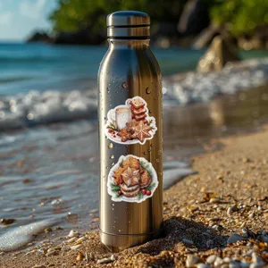 Stainless steel water bottle detail showcasing cute Christmas gingerbread and snowflake stickers.
