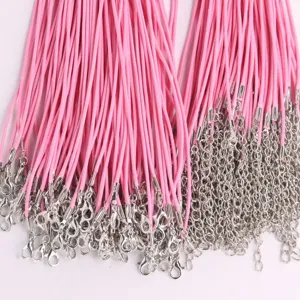 Close-up of pink wax cord necklace ropes with silver lobster clasps for DIY jewelry