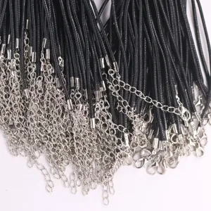 Detail of black wax cord necklace strings with silver lobster clasp extension chains