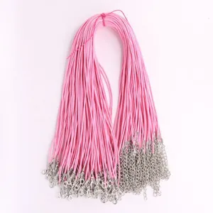 Detail of pink wax cord necklace strings with silver lobster clasps for DIY jewelry
