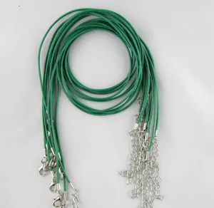 Detailed view of green wax necklace cords with silver lobster clasps for DIY jewelry making