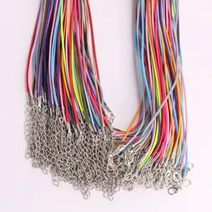 Detailed view of colorful DIY necklace cords with lobster clasps and extension chains.