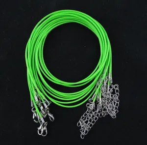 Detail of neon green wax cord necklace strands with silver lobster clasps.