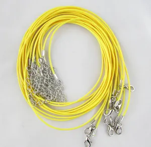 Detail of yellow waxed necklace cords with lobster clasps for DIY jewelry making